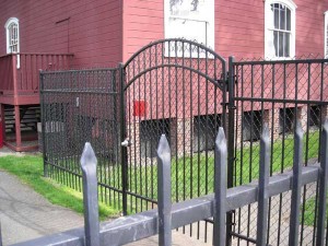 94 Ornamental iron fence and gate with chain link